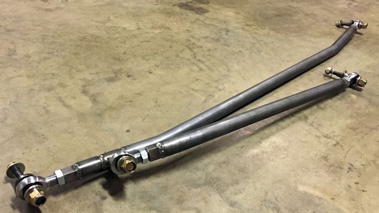 Dodge Off Road heavy-duty drag link and tie rod laid out on a shop floor