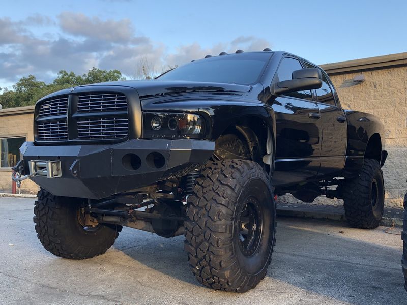Black 3rd gen Ram 2500 sitting on a Dodge Off Road 6-inch suspension system with large off-road tires