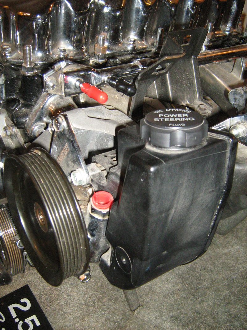Power steering fluid reservoir cap on a Jeep engine
